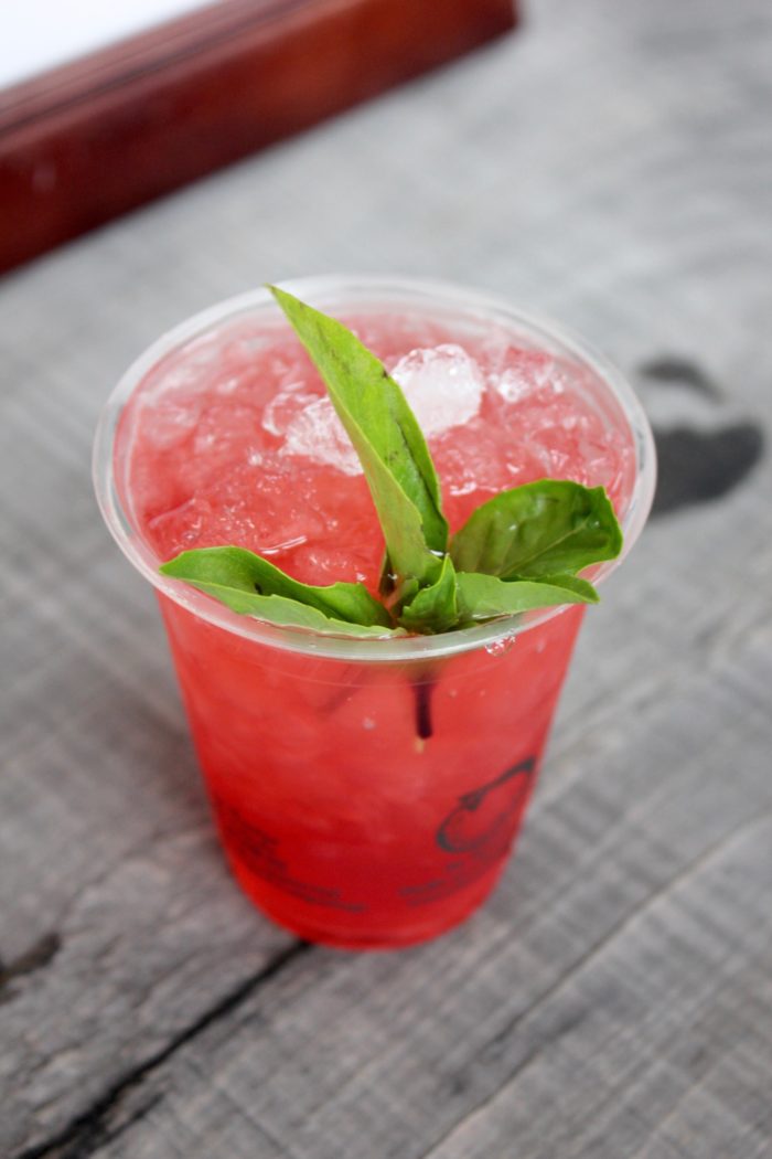Strawberry Rhubarb Cobbler, a gin cocktail with rhubarb syrup, basil black pepper syrup, and Thai basil