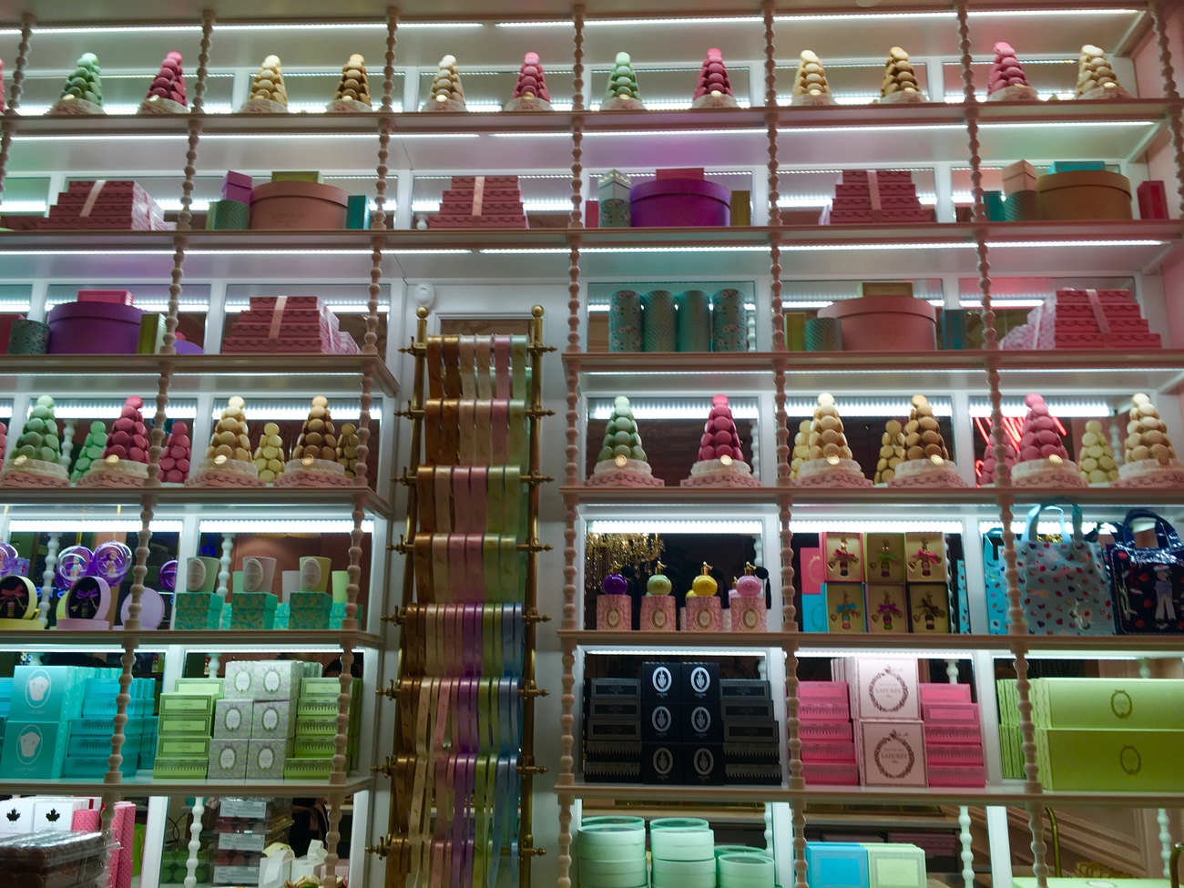 Back wall at Ladurée Toronto is covered in beautiful boxes for wrapping their signature desserts